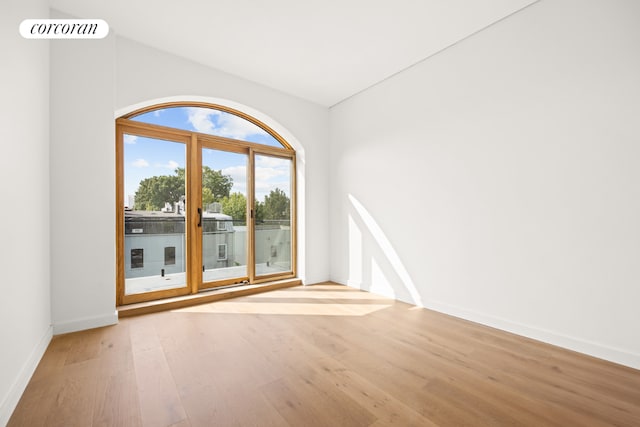 spare room with light hardwood / wood-style floors