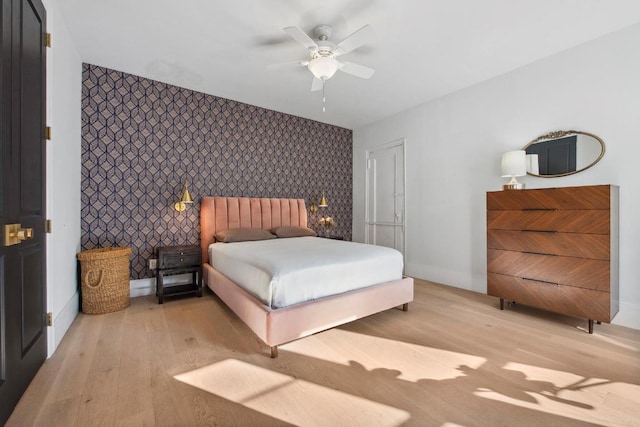 bedroom featuring ceiling fan and light hardwood / wood-style floors