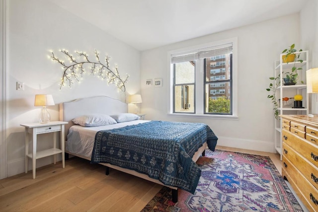 bedroom with light hardwood / wood-style flooring