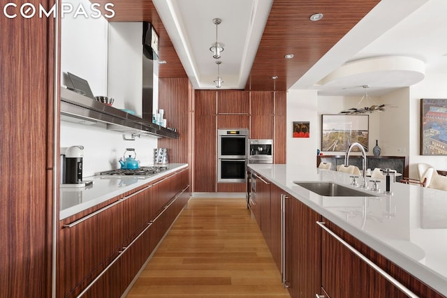 kitchen featuring light hardwood / wood-style floors, pendant lighting, sink, wood ceiling, and stainless steel appliances