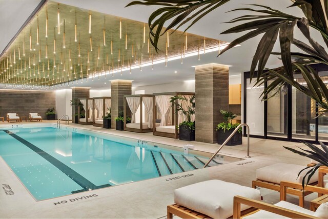 community pool with a patio area