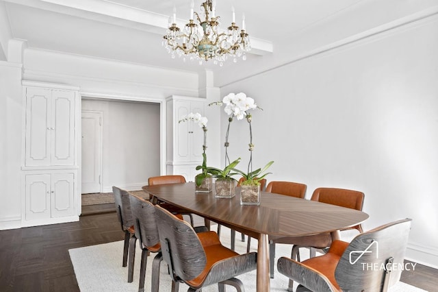 dining room with baseboards and an inviting chandelier