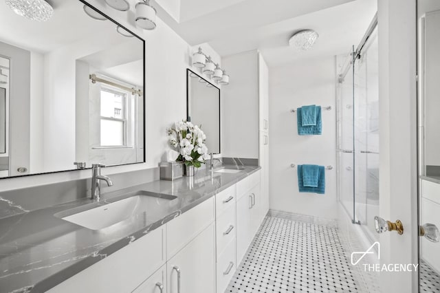 full bath with double vanity and a sink