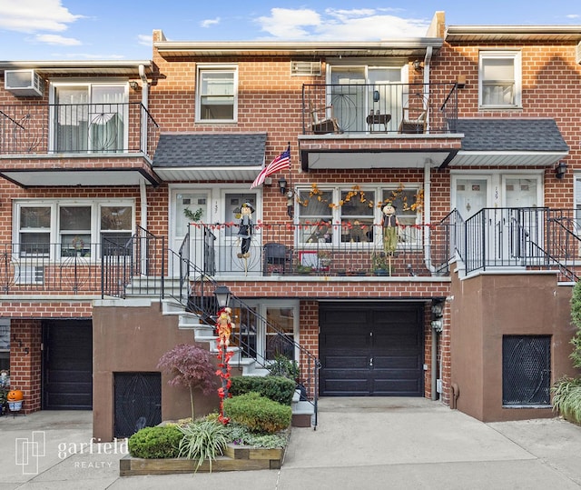 137 Bay Ridge Pkwy Unit 1, New York City, NY 11209 - multi unit property featuring brick siding, driveway, a garage, and stairway