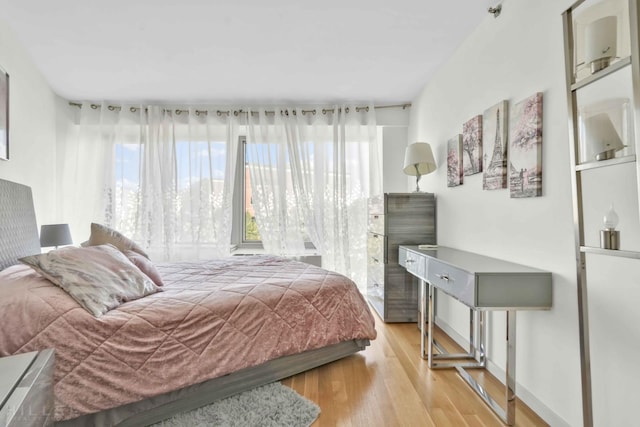 bedroom with light wood-style floors