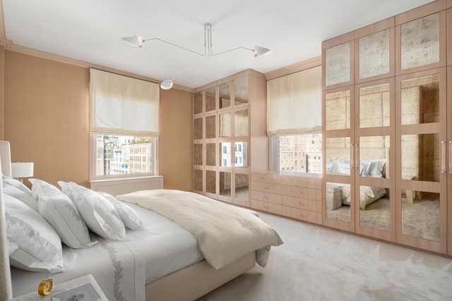 bedroom with light carpet and ornamental molding