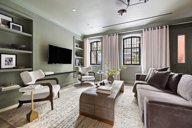 living room with crown molding and built in features