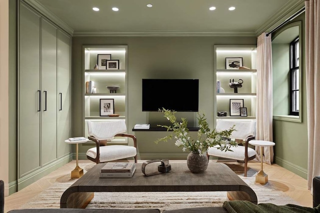 sitting room featuring crown molding and built in features