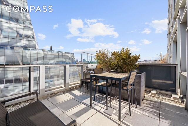 balcony featuring a patio and outdoor dining space