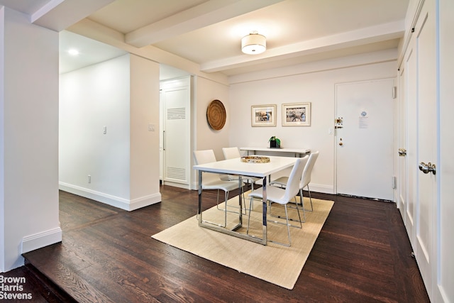 dining space featuring beam ceiling and dark hardwood / wood-style flooring