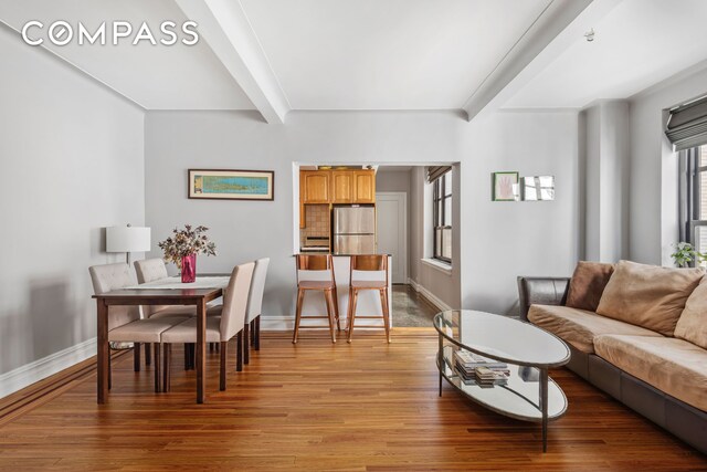 living room with beamed ceiling