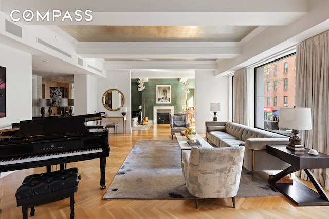 living area featuring beamed ceiling