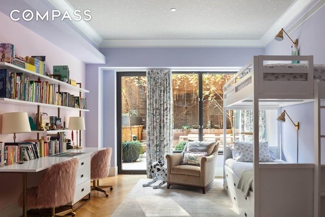 sitting room featuring ornamental molding and an office area