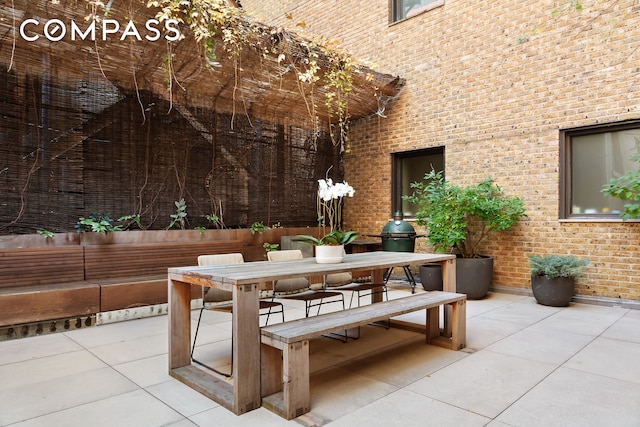 view of patio featuring outdoor dining area