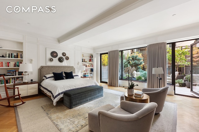 bedroom with beam ceiling, ornamental molding, and access to outside