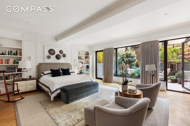 bedroom featuring access to outside and beamed ceiling