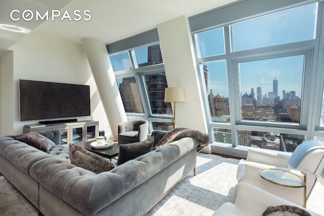 living room with a wealth of natural light and a city view