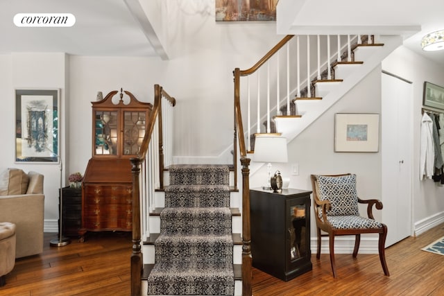 stairs featuring wood-type flooring