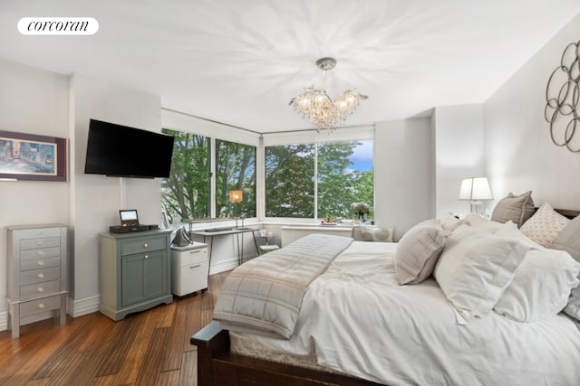 bedroom featuring dark hardwood / wood-style floors and a notable chandelier