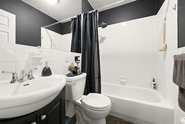 full bath featuring shower / bath combo with shower curtain, toilet, tile walls, decorative backsplash, and vanity