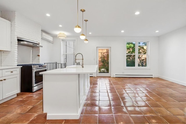 kitchen featuring pendant lighting, a baseboard radiator, light countertops, stainless steel gas stove, and a sink