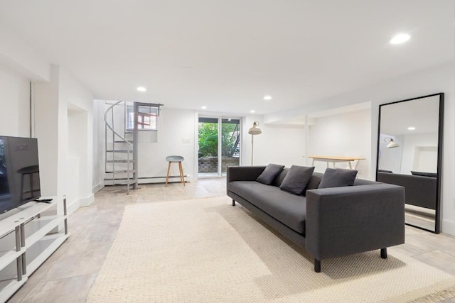 living room with a baseboard radiator, stairs, baseboards, and recessed lighting