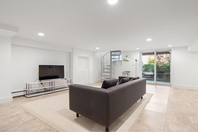 living area featuring a baseboard heating unit, stairway, baseboards, and recessed lighting