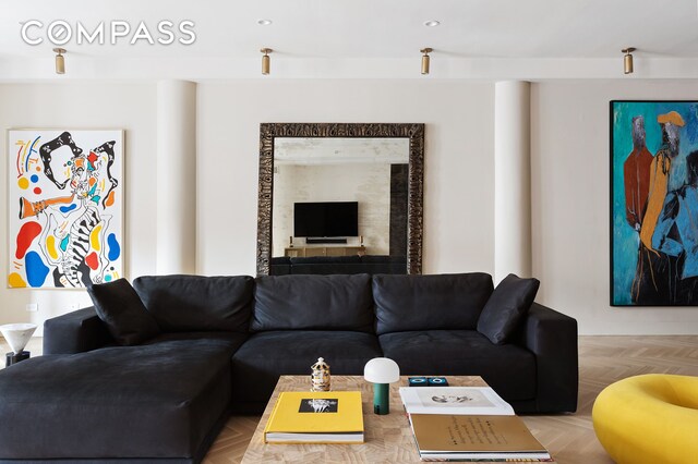 living room featuring light parquet floors