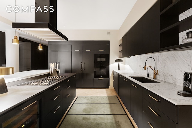 kitchen with wine cooler, dark cabinetry, open shelves, and a sink