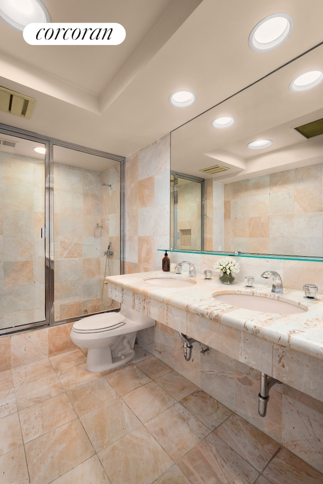 27 E 65th St Unit 5Bc, New York City, NY 10065 - full bath featuring tile walls, recessed lighting, a shower stall, double sink, and a tray ceiling