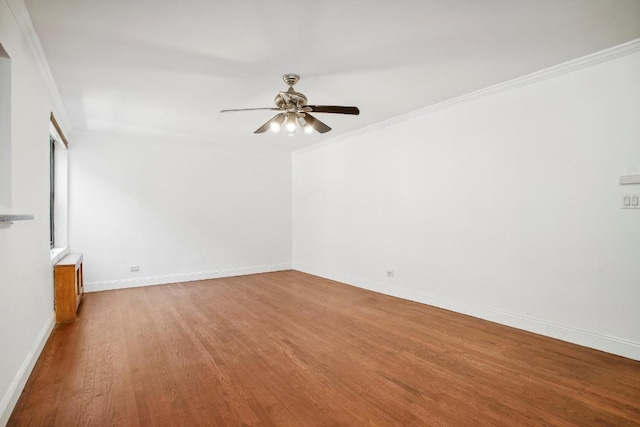 empty room featuring hardwood / wood-style floors, ceiling fan, and crown molding