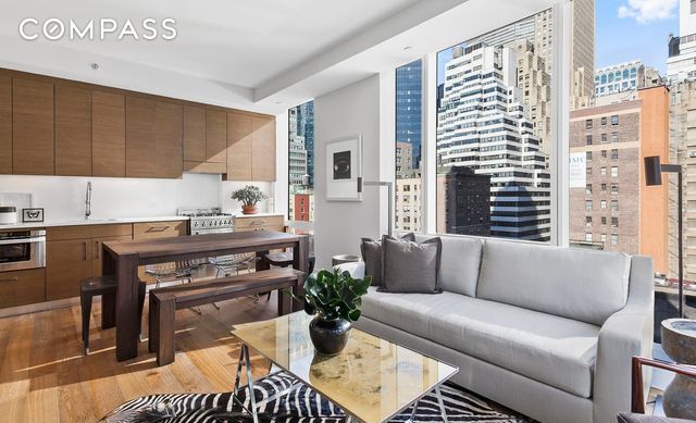 living room featuring light wood-style flooring and a view of city