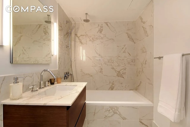325 Lexington Ave Unit 10D, New York City, NY 10016 - full bath featuring vanity, tile walls, a combined bath / shower with rainfall shower, and decorative backsplash