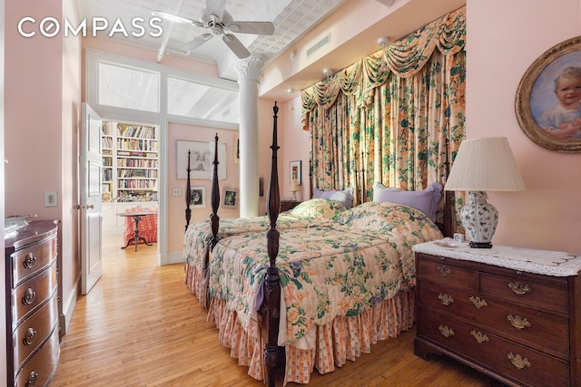 bedroom with light wood finished floors and baseboards