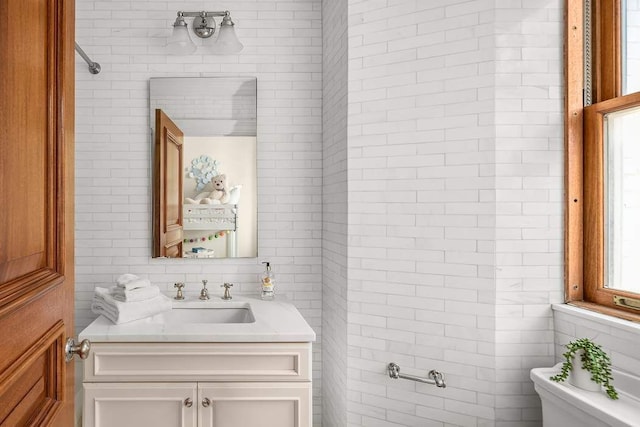 bathroom featuring vanity and toilet