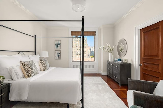 bedroom featuring crown molding, radiator heating unit, and dark wood-type flooring