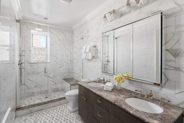 bathroom featuring tile walls, vanity, toilet, a shower with door, and crown molding