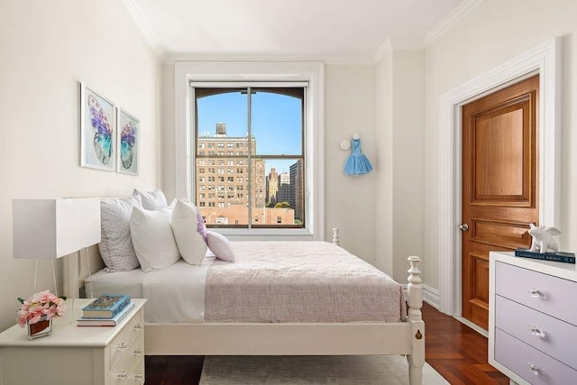 bedroom featuring crown molding and dark parquet floors