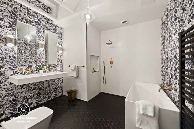 full bath with a tub, toilet, and tiled shower