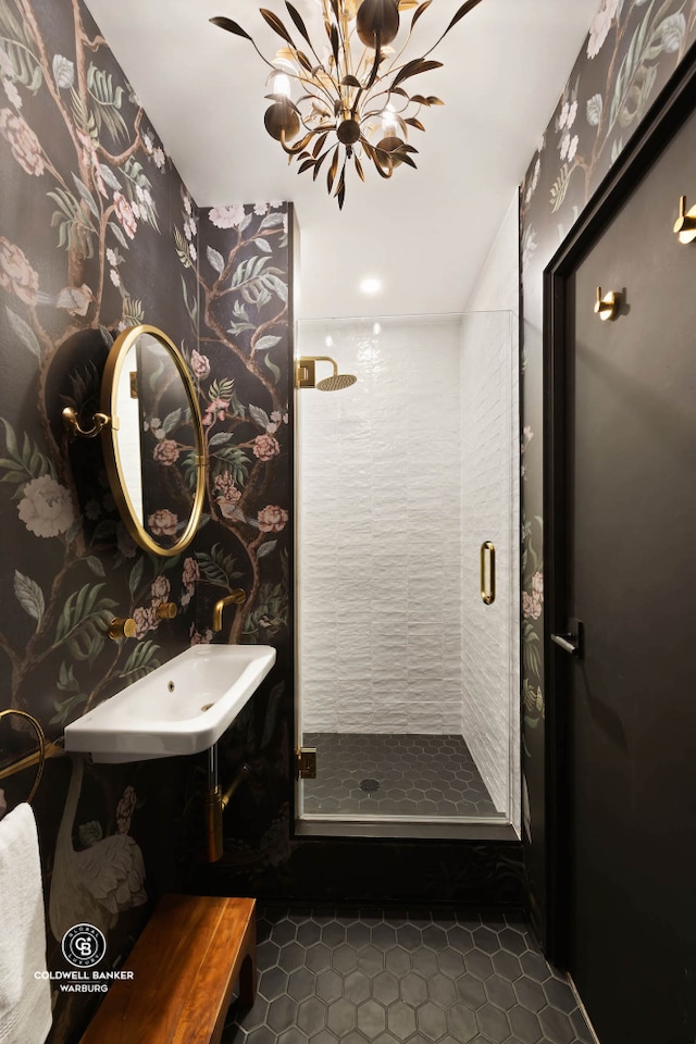 bathroom with tile patterned floors and a shower stall