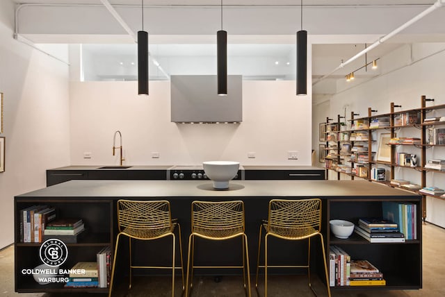 bar with a sink and track lighting