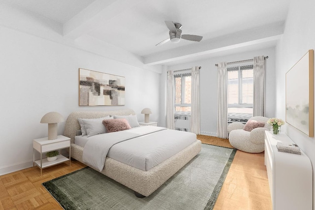 bedroom featuring ceiling fan, parquet floors, and beamed ceiling