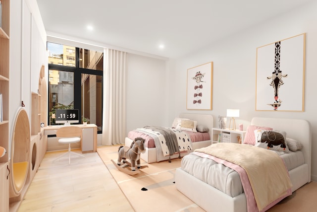 249 E 50th St Unit 7A, New York City, NY 10022 - bedroom with wood finished floors and recessed lighting