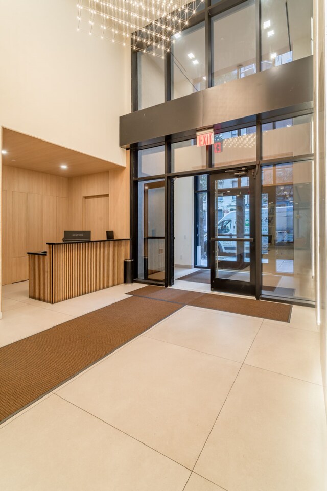 249 E 50th St Unit 7A, New York City, NY 10022 - building lobby featuring a towering ceiling