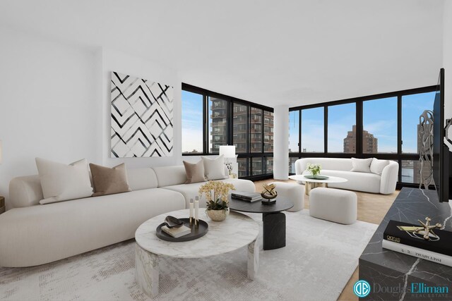 living area featuring a city view and expansive windows