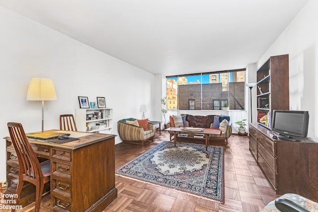 living room with floor to ceiling windows and dark parquet flooring