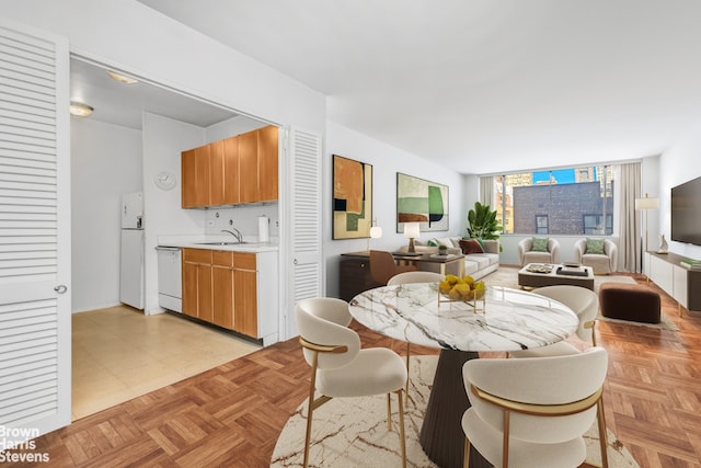 dining room featuring light parquet floors