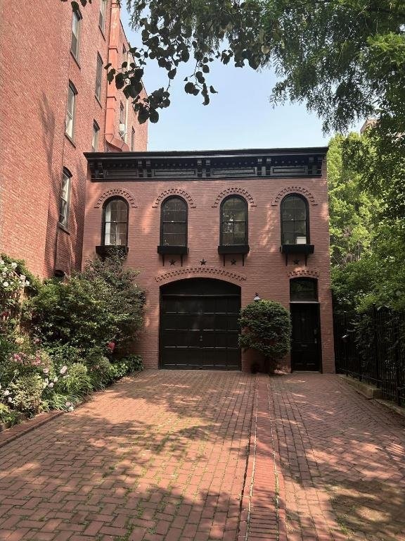 italianate home featuring a garage