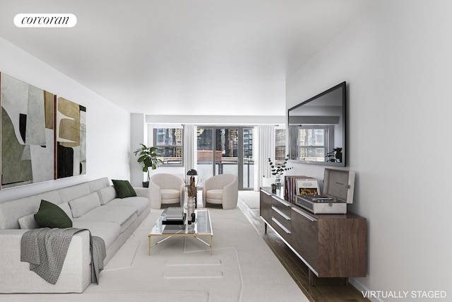 living room with wood finished floors and visible vents