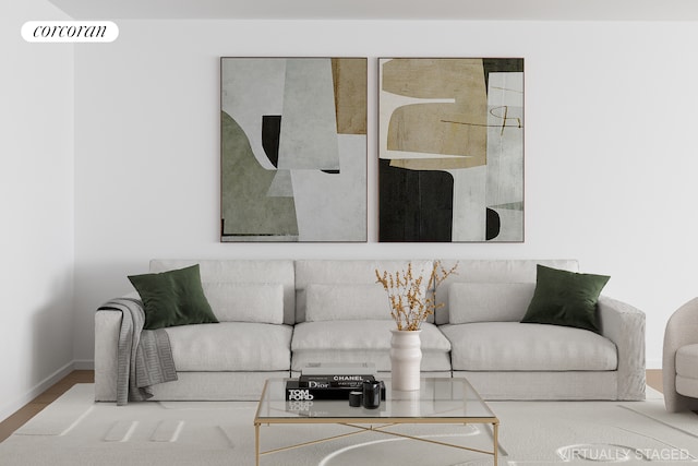 living area featuring wood finished floors, baseboards, and visible vents